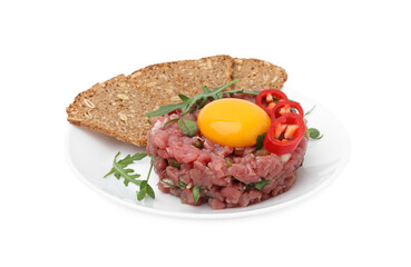 Tasty beef steak tartare served with yolk, pepper, bread and greens isolated on white