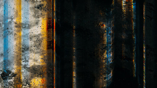 Glitch lines. Dirty surface. Old film effect. Black background with blue yellow blurred muddy striped spotted texture overlay.