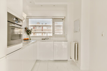 Fototapeta na wymiar a modern kitchen with white cabinets and appliances on the countertops in an apartment near barcelona, spain - stock photo