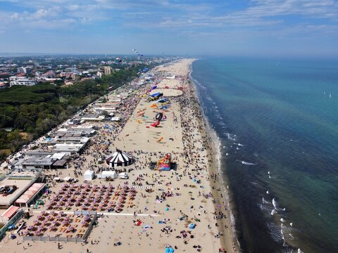 Aerial view of a gathering of kites on the beach at Pinarella di Cervia, Ravenna, Italy