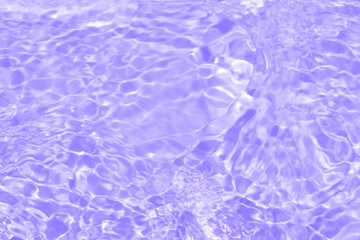 Purple water with ripples on the surface. Defocus blurred transparent pink colored clear calm water surface texture with splashes and bubbles. Water waves with shining pattern texture background.