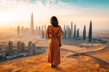 Foto op Canvas Woman standing and looking at a Dubai landscape © MVProductions