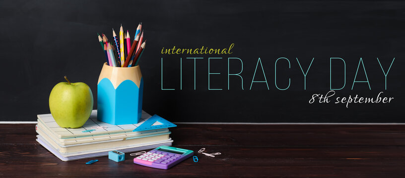 Banner for International Literacy Day with apple and school stationery