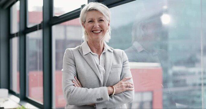 Mature woman, lawyer and face with arms crossed by window in office management, about us and professional law firm. Portrait, smile and confident attorney in consulting workplace for legal leadership