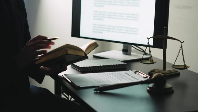 Lawyer business woman working or reading lawbook in office workplace for consultant lawyer concept