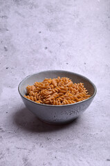 Dry dark brown pasta