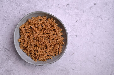 Dry dark brown pasta