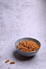 Dry dark brown pasta