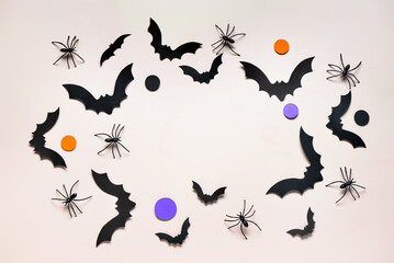 Frame made of paper bats and spiders for Halloween party on grey background