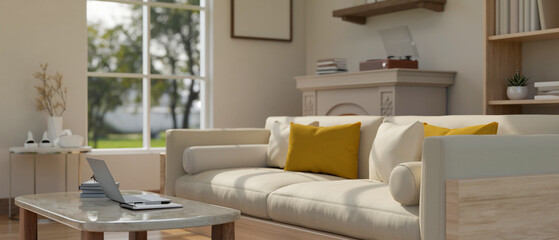 A modern and cozy living room with a comfortable couch, a laptop on a coffee table