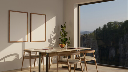A beautiful Scandinavian dining room with a minimal dining table, frames mockup on the wall