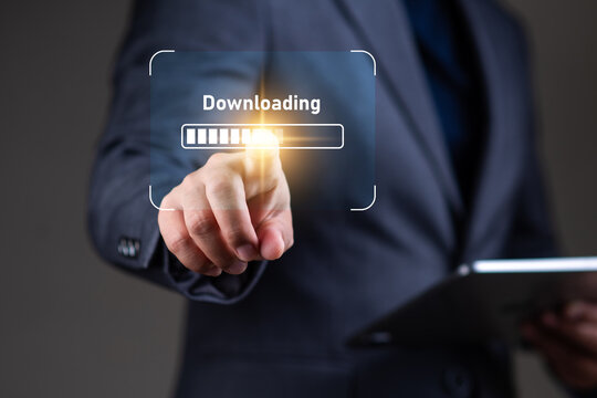 File and data downloading concept, businessman using tablet with data file downloading icon on virtual display, digital file transfer, server.