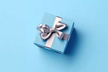 A blue gift box with a silver bow