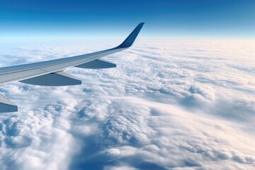 Fototapeta na wymiar An airplane wing soaring above the majestic clouds