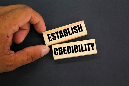 wood with the words ESTABLISH CREDIBILITY. the concept of credibility