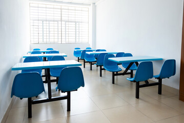 Cafeteria with empty seats and tables