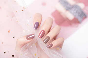 Beautiful colored nail polishes with shine and reflections,Fashionable spring summer nail design,large aperture blurred background