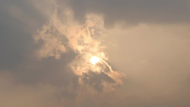 Beautiful timelapse of clouds formation with golden sunset