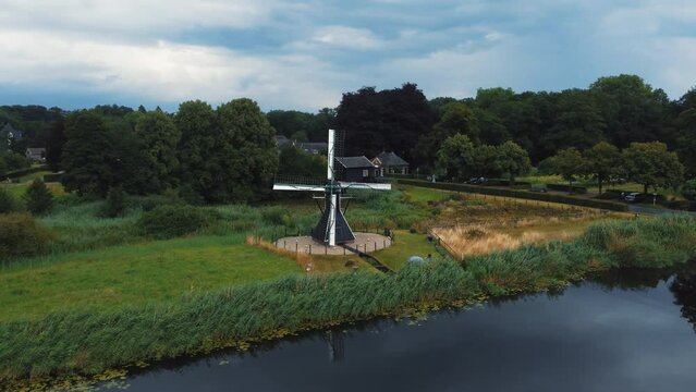 Keppel water mill: aerial view in orbit to the beautiful mill located in the netherlands and on a sunny day.