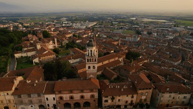 Old Town in Northern Italy at Sunrise. The old medieval buildings are lit by the first light of the day.