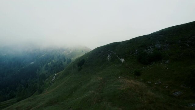 Clouds on Mountain in Summer. The low clouds are coming up the side of Monviso, in Italy, covering the ridge of the mountain