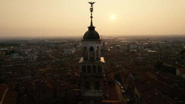 Old Town in Northern Italy at Sunrise. The old medieval buildings are lit by the first light of the day.
