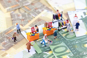 Miniature scenario stall economy on money - obrazy, fototapety, plakaty