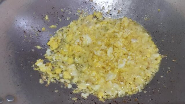 Scrambled eggs or omelette with butter and oil. Cooking Eggs for Breakfast