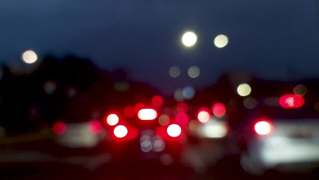 Defocused traffic lights street city abstract . City blur background. Moving bokeh circles of night traffic.