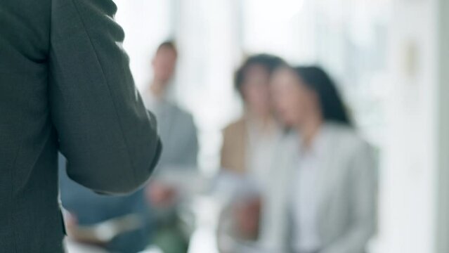 Business, conference and man with blurred background at seminar, presentation and mentor training in office. Workshop, coach and motivation, leader and team in meeting for strategy, planning and b2b.