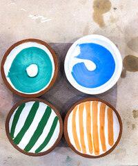 A selection of bisque ceramics that has been glazed and ready for the second glaze firing