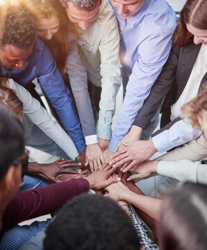 Teamwork, unity concept, group of friends put their hands together with copy space