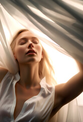Fashion surreal Concept. Closeup portrait of stunning beautiful woman girl surround with white ivory sensual flowing flying silk cloth. illuminated with dynamic composition and dramatic lighting