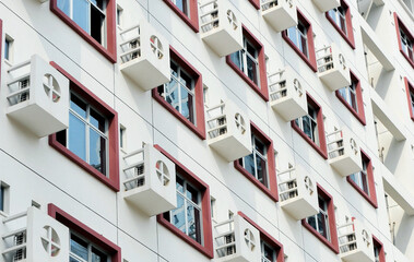 Apartment building wall with large group of air-conditioners, China
