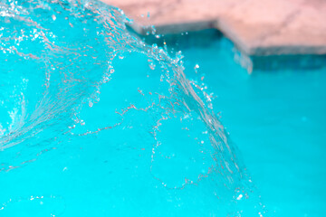 Instant shot of the water flowing from the fountain of the ornamental pond