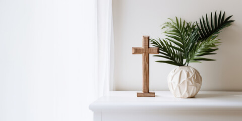 Obraz na płótnie Canvas Palm Sunday. Wooden cross and palm leaf on a white shelf in the room