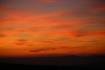 Fototapeta na wymiar Red sunset and mountains silhouette