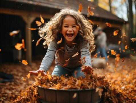 kids playing in a pile of colorful autumn leaves