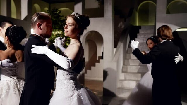 dancing pairs on dance floor in royal palace in night, medium portrait, slow motion shot