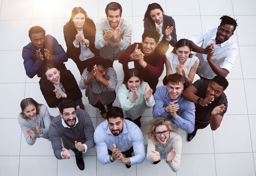 Group Of Happy Young Business People Looking Up