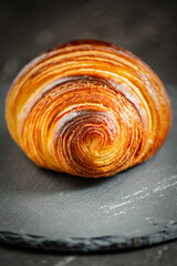 Detailed close-up of crispy, flaky, and delicious butter croissant