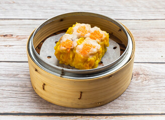 crab roe siu mei served in dish isolated on wooden table top view hong kong food