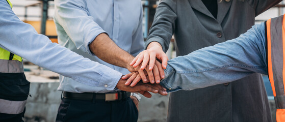 Close up Engineer team after success work. Stacked and  Shake in a Hand. Teamwork concepts.Joins...