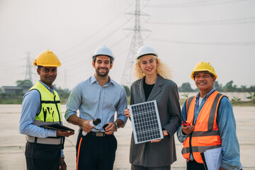 Engineers working on solar installations to create an eco-friendly and renewable power generation. Professionals working outdoors to develop modern and sustainable solar energy solutions.