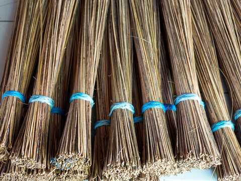 Sapu lidi, stick brooms crafted using coconut leaf bones, traditionally used to sweep the floor in Indonesia