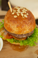 Hamburgers on a wooden tray