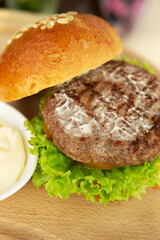 Hamburgers on a wooden tray