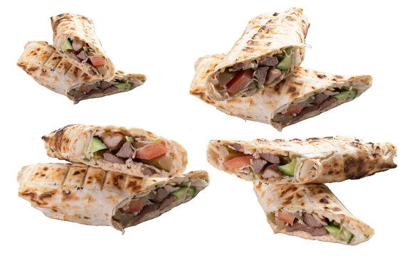 Shawarma with beef and vegetables. Selective focus. Transparent