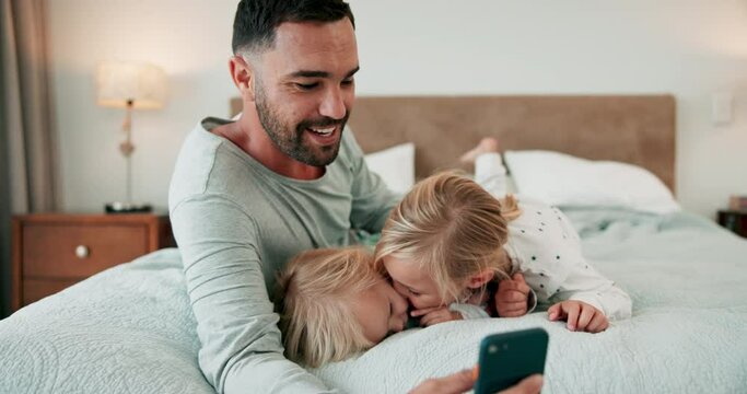 Family, dad and selfie with a girl kissing her sister on a bed of their home in the morning while bonding together. Love, children and a single parent in the bedroom having fun while taking a picture