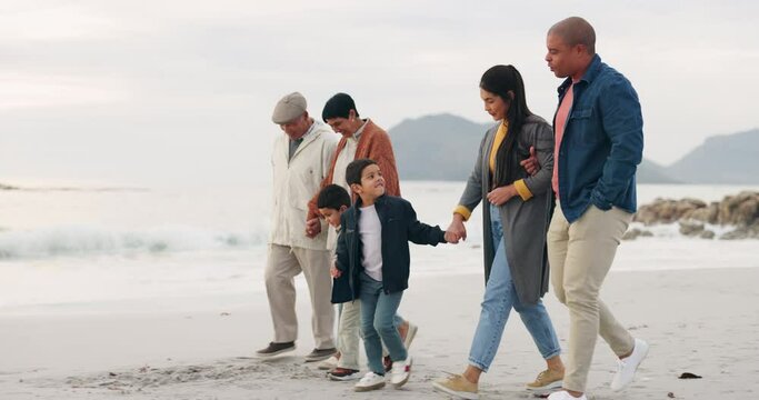 Family, walk on beach sand and holding hands, generations and travel with ocean, trust and bonding outdoor. Winter, nature and grandparents with parents and children, adventure and freedom on journey